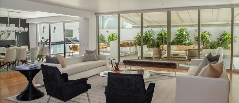 large living space with chairs and plants